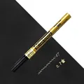 Sakura Pen-touch extra fine 0.7mm gold permanent paint marker on black background - 0.7mm / Gold