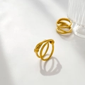 Detail of twisted multi-layer knot ring in 18K gold plated titanium steel finish - Double Layer Knot / US 7