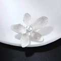 Vintage silver five-petal flower brooch with pearl center on white ceramic plate - Matte Silver