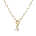 Detailed macro view of gold paperclip chain necklace with pearl-inlaid zodiac pendant - Capricorn / Gold