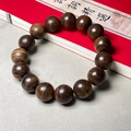Dark brown 15-bead Agarwood bracelet featuring natural wood grain and polished finish - 12mmx17 Beads Plain Style