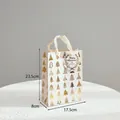 White Christmas gift bag with gold foil trees and cream ribbon handles, 23.5x17.5cm - Small Handbag Tree Pattern