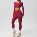 Detail view of burgundy seamless yoga set featuring crop top and high-waist leggings - S / Top And Bottom / Carmine