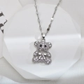 Sparkling silver bear pendant necklace with zircons on a white geometric stone - Silver