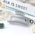 Translucent grey geometric hair claw clip with metal spring for daily styling - Jelly Grey