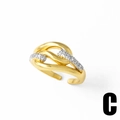 Detailed macro view of 18k gold butterfly twist ring featuring white crystal accents - Double Line Twist Style C