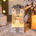 Leuchtende Weihnachts-Wasserkuppel als Geschenkbox mit Schneemann und wirbelndem Glitzer - Schneemann / Weiß