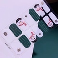 Détail de stickers à ongles de Noël avec motifs bonhomme de neige et flocons en vert et blanc - Style Rayures Dorées Flocon de Neige Bonhomme de Neige Vert (SDA-034)