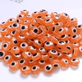 Flat round orange resin evil eye beads for DIY jewelry making and bracelet accessories - Orange