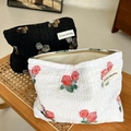 Quilted floral makeup bag set with rose patterns and secure zipper on woven bench - Wrinkled White Rose