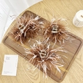 Three-piece set of fluffy brown ostrich feather claw clips on a wooden tray - Brown & White Feather Claw Clip Small 9.5cm
