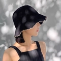 Black crochet bucket hat with cream wavy trim shown on model in natural lighting - Wavy Edge Bucket Hat Black