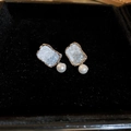 Detail of gradient crystal flower earring with gold base and pearl on black velvet - Square (No.3)