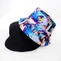Detail view of double-sided bucket hats in solid black and colorful tie-dye patterns - Multicolor Art Print