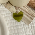 Detail of green heart acetate hair clip with FRANCE handmade engraving on fabric - Green