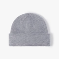 Warm winter grey knitted beanie hat featuring a textured brim for outdoor activities - Light Gray