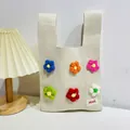 Chic cream knit tote bag featuring colorful 3D crochet flowers and small brand label - Colorful Small Flowers Beige