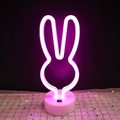 Pink rabbit-shaped LED neon desk lamp with a white round base and power switch - Pink Bunny