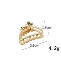 Small golden metal hair claw clip with floral design, size 2.6cm by 1.8cm - Gold Crescent