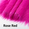 Close-up of fluffy rose red 12cm faux fur fabric with soft long plush texture - 5cm Width * 180cm / Rose Red