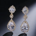 Elegant gold drop earrings featuring three-tier pear-shaped AAA cubic zirconia stones - Fsep2034b Earrings Gold Teardrop Shape Set With Cubic Zirconia.