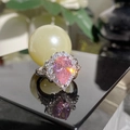 Elegant silver halo ring featuring a large pear-shaped pink stone on a black reflective surface - Jz885【cucium Powder Drill】ljz-21 / Adjustable Open