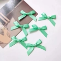 Set of six mint green satin bow hair clips in a sweet ballet style for girl's styling - Green