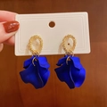 Klein blue petal earrings with golden textured metal rings on a white card display - Blue Petal