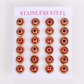 Macro view of 12 pairs of red evil eye earrings in gold-tone stainless steel settings - Lace Gold Frame Red (12 Pairs Set)