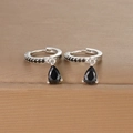 Macro detail of silver drop earrings with pear-cut black zircons and hoop design - Silver Black Zirconia