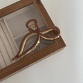 Elegant coffee brown bow hair claw clip with gold metal teeth on a glass jewelry box - 11.5CM / Khaki