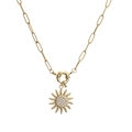 Detail of gold sun pendant necklace with pavé zircon on a paperclip link chain - Gold Necklace
