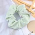 Detail of light green stretch fabric scrunchie featuring multiple small inlaid rhinestones - Light Green