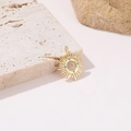 Detail of sun pendant with turquoise beads on a natural stone background - H-8791 (Turquoise Bead Sun)