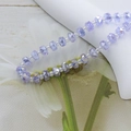 Detailed close-up of 6mm purple faceted crystal glass beads for DIY jewelry making - 4*6mm (Approx. 100pcs) / Crystal Purple AB