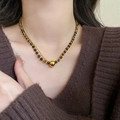 Detail of layered gold snake chain and tiger eye beaded necklace on model - 4# Necklace - Gold-Brown (Double Layer Gold Bead Pendant Style)