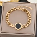 Gold-plated stainless steel Cuban link bracelet featuring a Roman numeral black disc - 5178 Gold Roman Numerals Disc (5178 Gold)