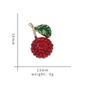 Detail view of lychee brooch with red rhinestones and green leaf showing 16mm x 13mm size - Rhinestone Lychee-TZ288