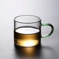 Heat-resistant borosilicate glass tea cup featuring a stylish green handle - Green Handle