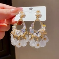 Close-up of vintage gold earrings with flower accents and white teardrop tassel pendants - Style 20# Silver Pin-Gold-White