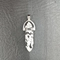 Polished black and white spotted stone bullet point pendant with silver metal bail - Black Impression Jasper
