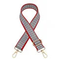 Close-up of adjustable fabric bag strap with red edges and black-white star patterns - Style 24 (Black White Red Edge/Gold Buckle)