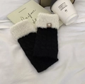 Knitted black arm sleeves with white faux fur cuffs and a small logo patch - Cable Knit-Black