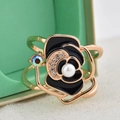 Elegant rose gold camellia ring with black enamel, pearl center, and sparkling crystals - Black Camellia Aurora Diamond