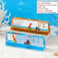 Minuteur liquide à mouvement dinosaure avec volcan et paysage en bleu et orange - Ornement Volcan Dinosaure