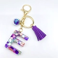 Letter E resin keychain with purple glitter stars and matching suede tassel charm - Letter E