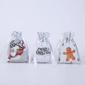 Tre sacchetti regalo natalizi con coulisse e motivi di Babbo Natale, renne e pan di zenzero - 50 pezzi / Bianco 3 Stili Misti