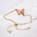 Elegant gold butterfly chain bracelet with pink crystal pendant and adjustable slider - Pink