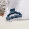 Macro shot of large matte misty blue hair claw clip with minimalist cutout design - Semi-circle / Navy Blue