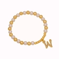 Beaded bracelet featuring gold metal beads, white pearls and a crystal letter W charm - Letter W